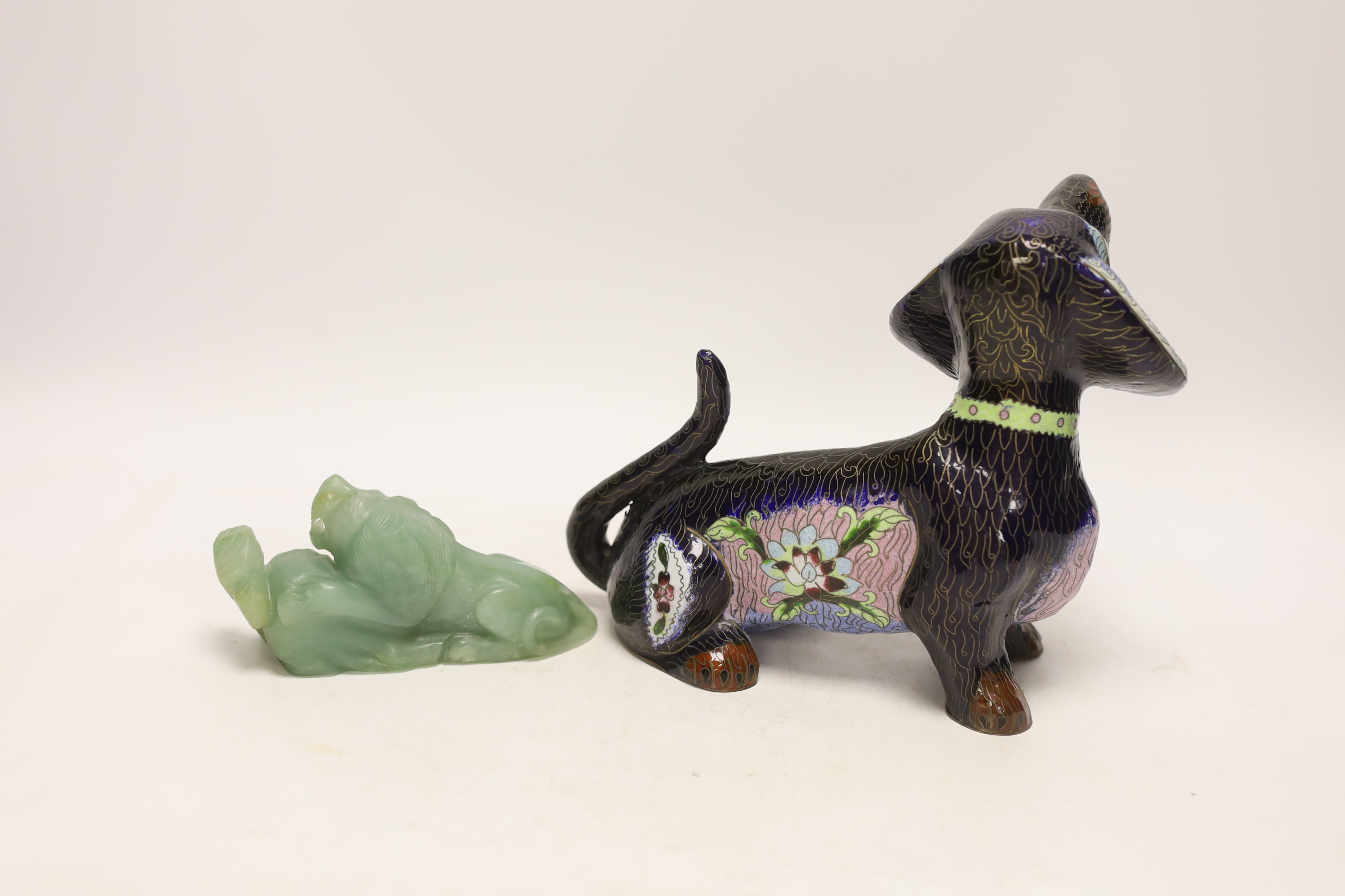 A Chinese bowenite jade figure of a lion, 6cm high, and a Chinese cloisonné enamel seated figure of a hound, 18cm high